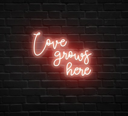 Love Grows Here Neon Sign