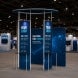 10 ft Island Trade Show Booth with Circular Header Lifestyle 1